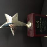 Gold Star Award on Rosewood Piano Finish Base