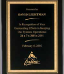 Black stained piano finish plaque with a black textured center plate and florentine border